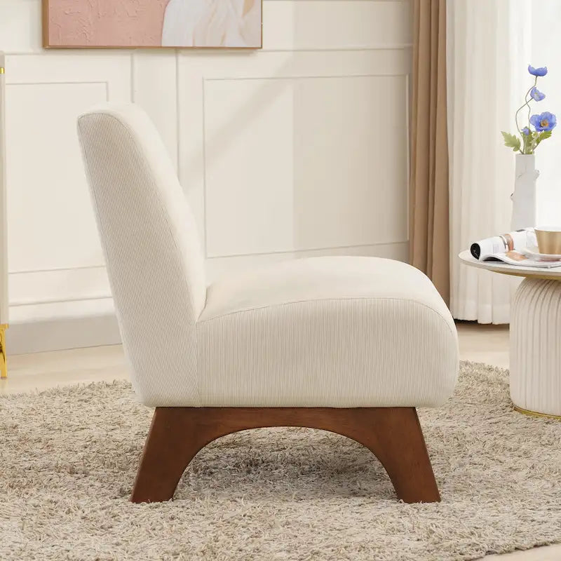 Poltrona decorativa in velluto a coste senza braccioli, con gambe in legno massello e seduta imbottita